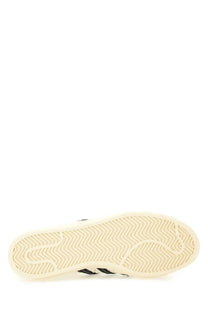 Back view of adidas originals by wales bonner men’s sneaker superstar with cream rubber sole and black 三条纹 logo on heel
