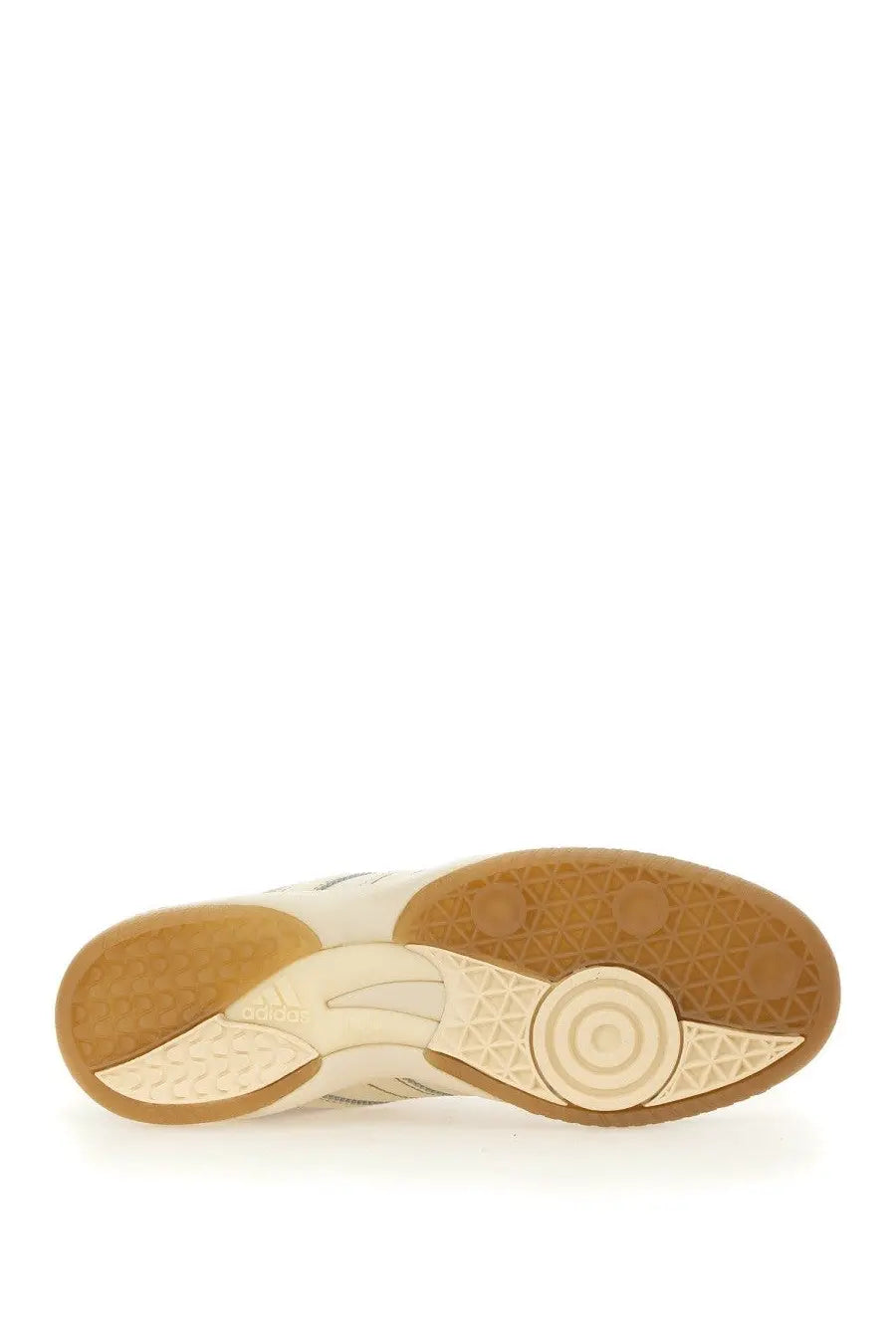 Cream-colored adidas Originals by Wales Bonner unisex Samba sneaker with tan rubber sole and geometric tread patterns