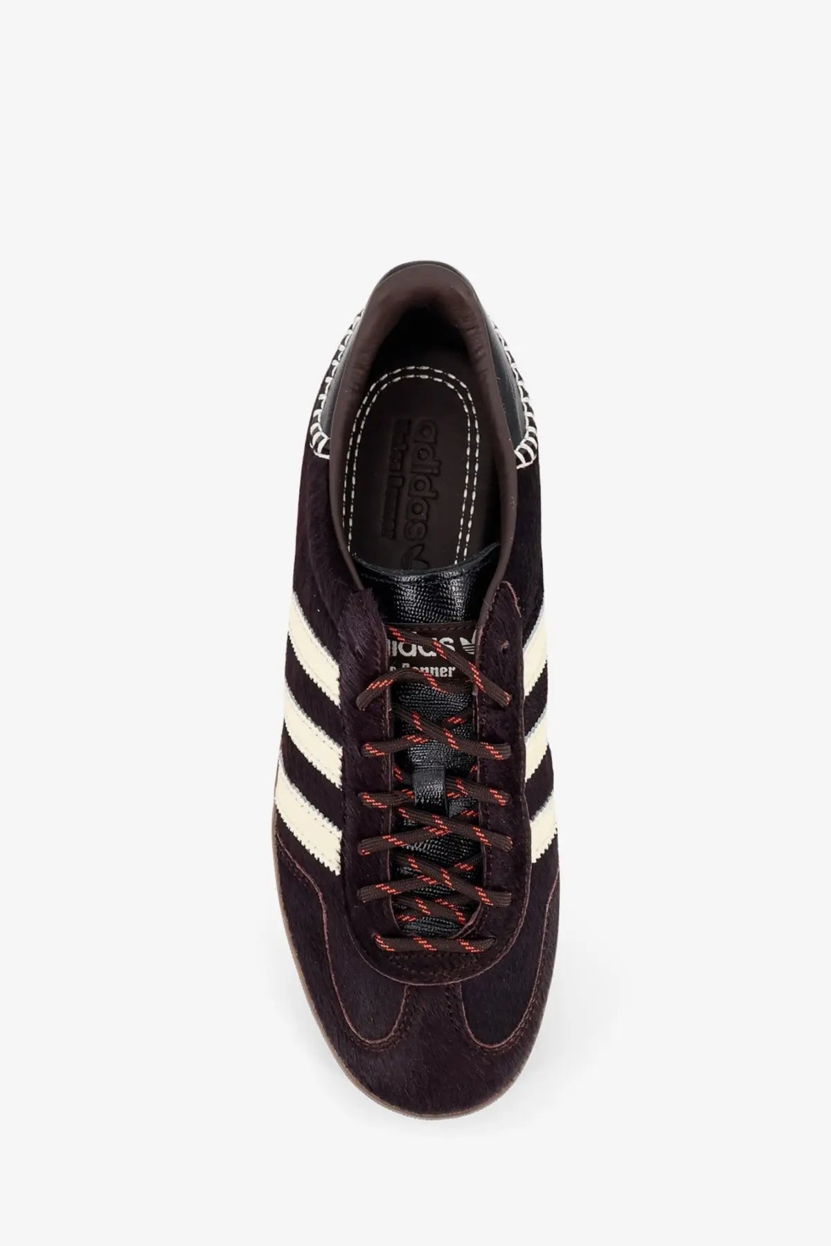 Dark brown suede adidas originals by wales bonner unisex wb gazelle sneakers with white stripes and red black laces