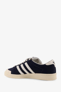 Navy blue suede adidas superstar sneaker with white stripes and cream rubber toe cap in mens chavarria jabbar low design