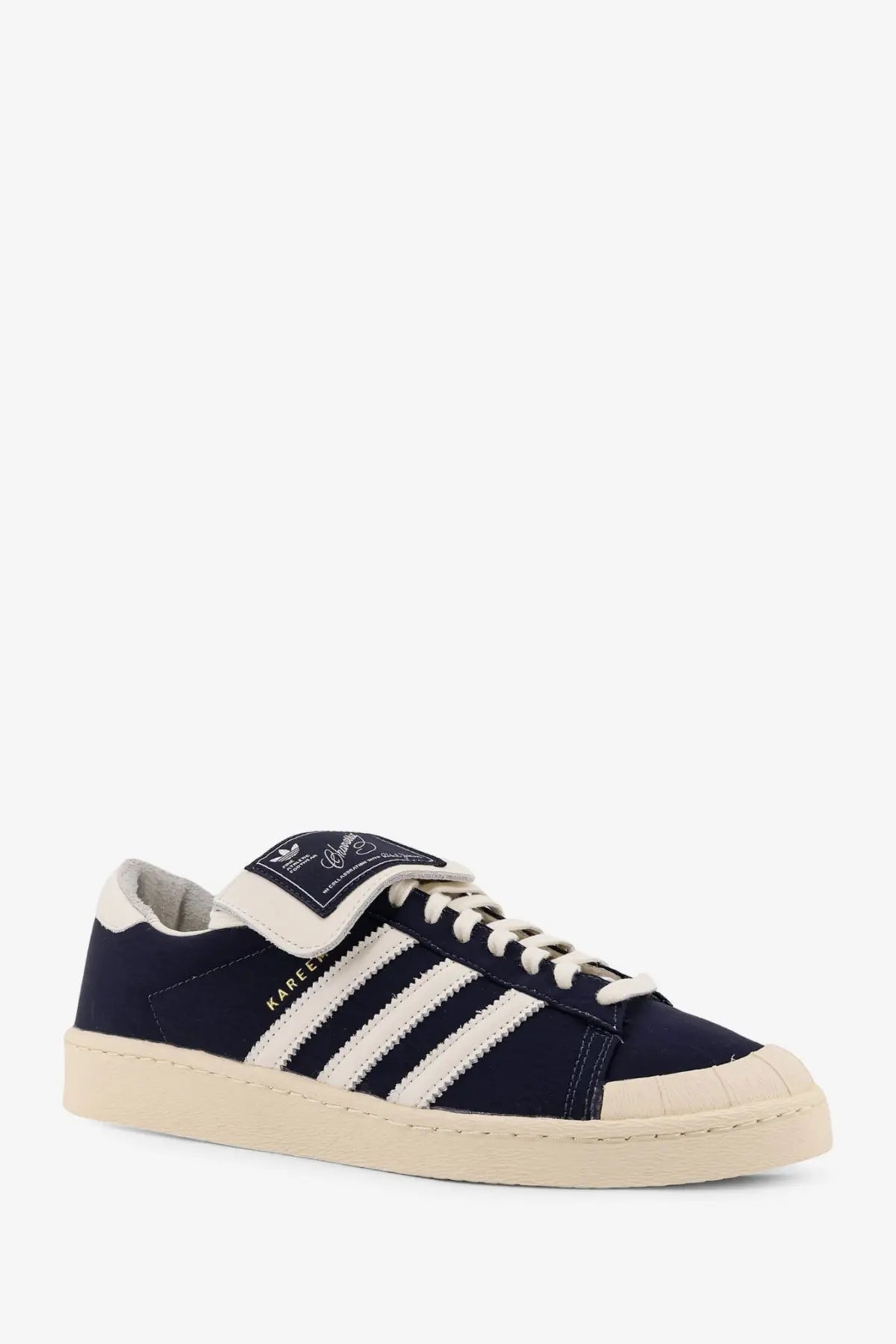 Navy blue suede adidas superstar sneaker with white rubber toe cap and three stripes from adidas Originals x Willy Chavarria