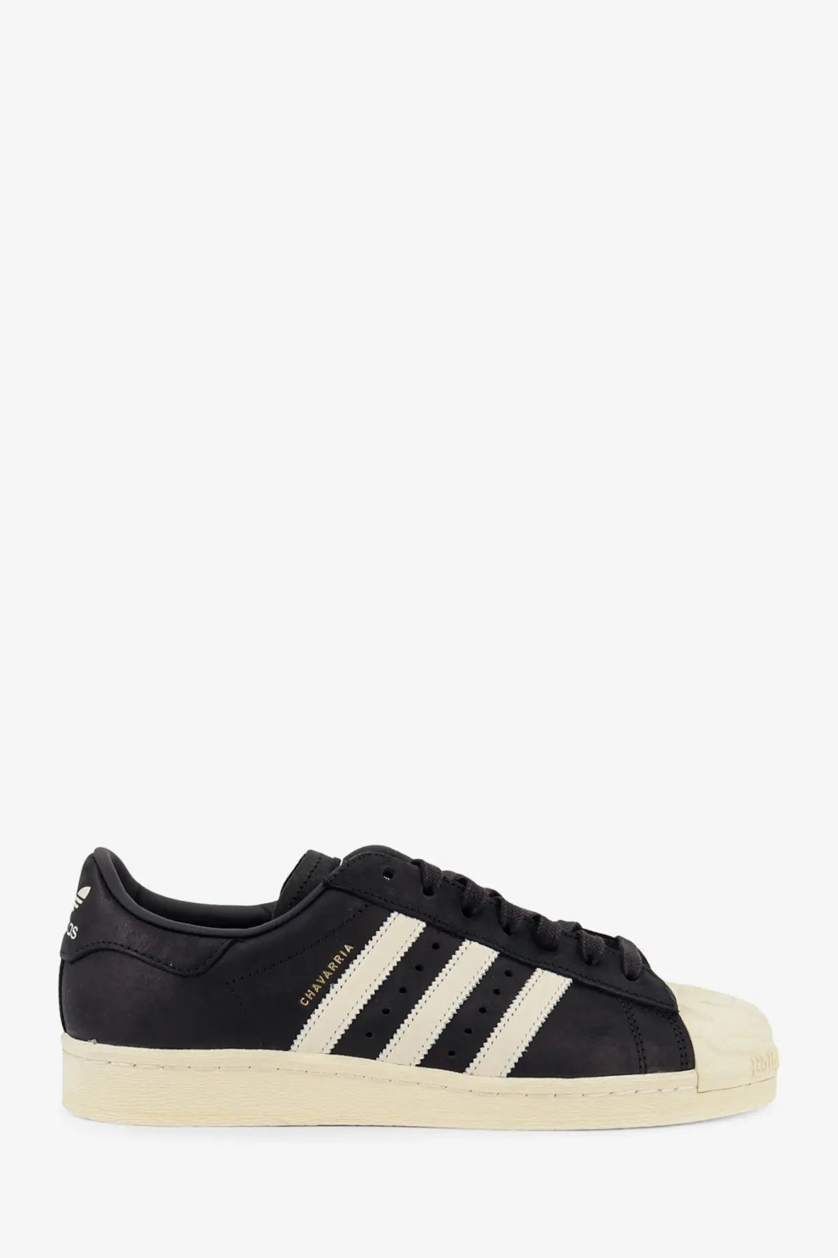 Black leather adidas originals x willy chavarria superstar sneakers with cream rubber toe cap and three stripes