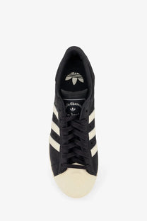 Adidas originals x willy chavarria men’s leather superstar sneakers black with cream rubber toe cap and white stripes