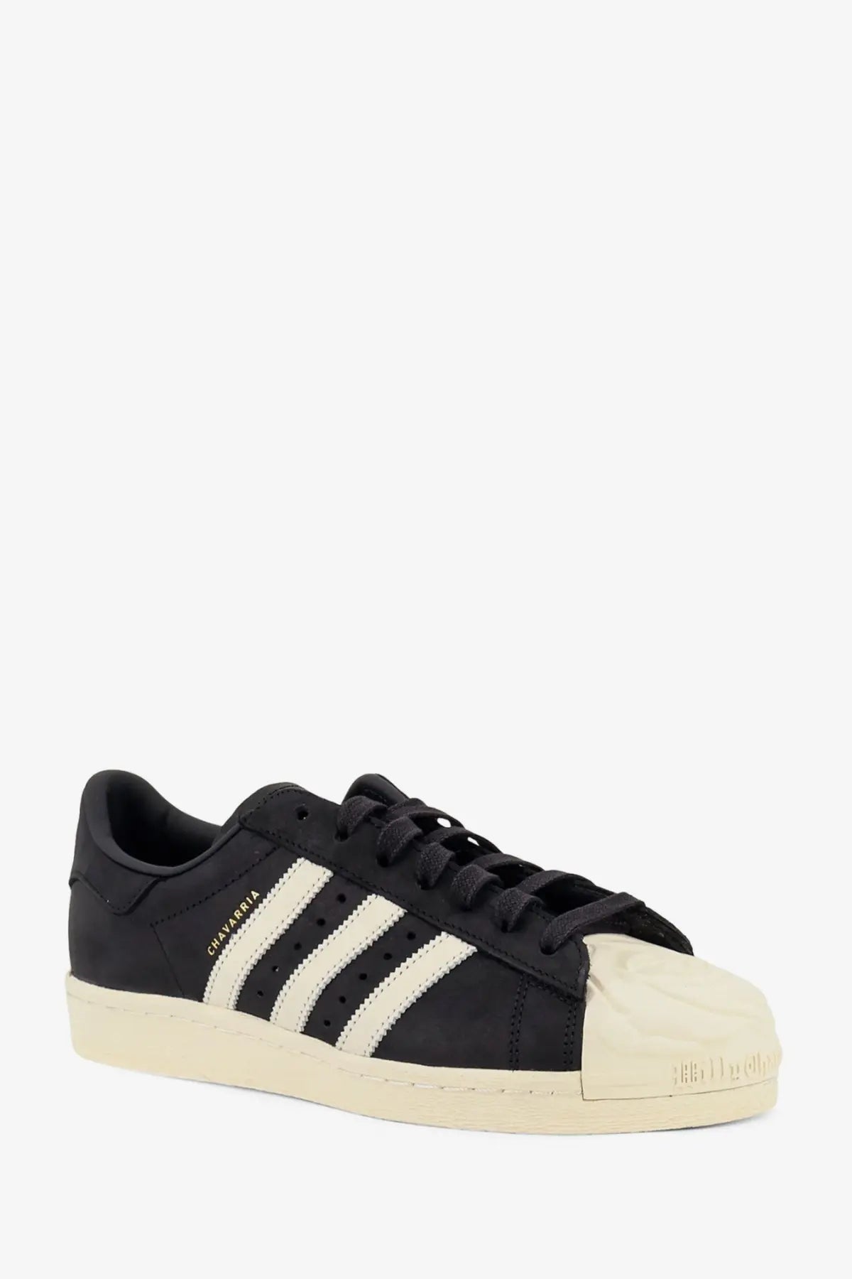 Adidas originals x willy chavarria men’s black suede leather superstar sneaker with three white stripes and cream toe cap