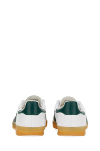 Adidas unisex gazelle indoor shoe in white with dark green accents and gum-colored rubber sole