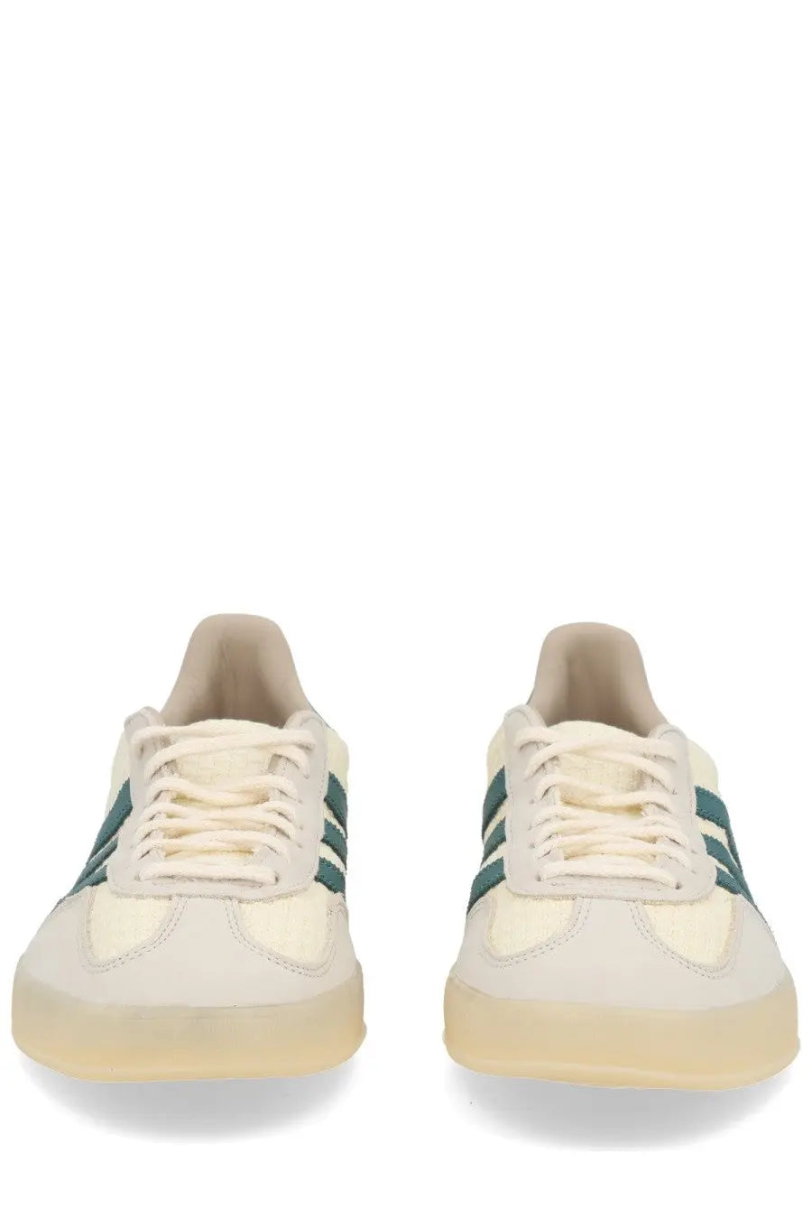 Cream-colored adidas unisex gazelle indoor sneaker beige with teal stripes and a translucent rubber sole