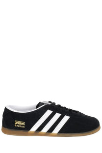 Black suede adidas unisex gazelle lo pro sneaker with white three stripes and gold branding on the side