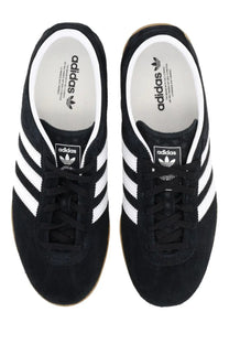 Adidas unisex Gazelle LO Pro sneaker in black suede with white three stripes and gum rubber sole
