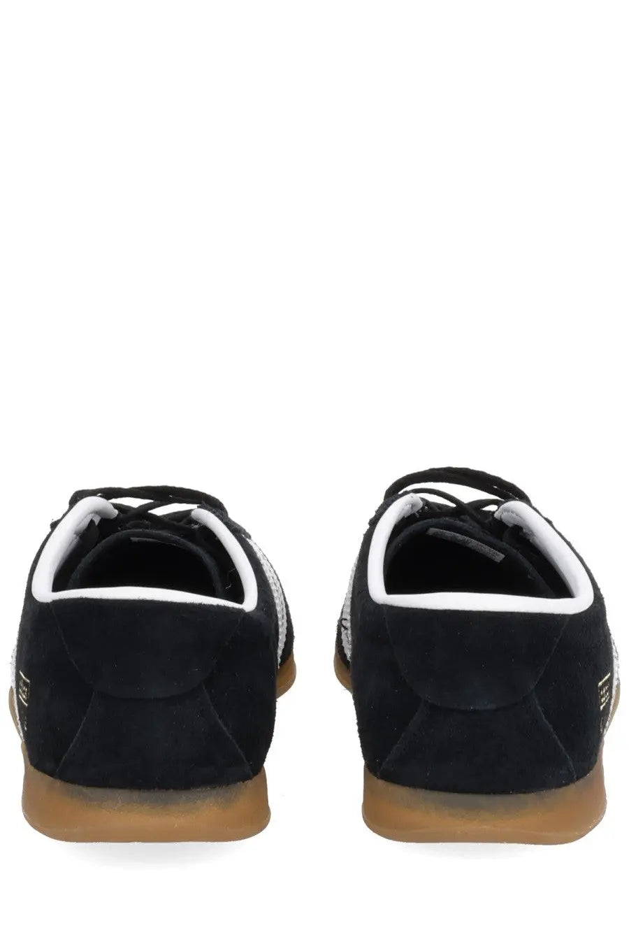Adidas unisex gazelle lo pro sneaker in black suede with white accents and tan rubber sole showing the back side