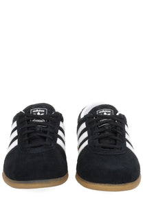 Adidas unisex gazelle lo pro sneaker black in black suede with white three stripes and gum rubber soles