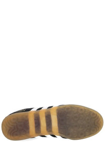 Adidas unisex gazelle lo pro sneaker black with black and white leather upper and gum-colored rubber sole