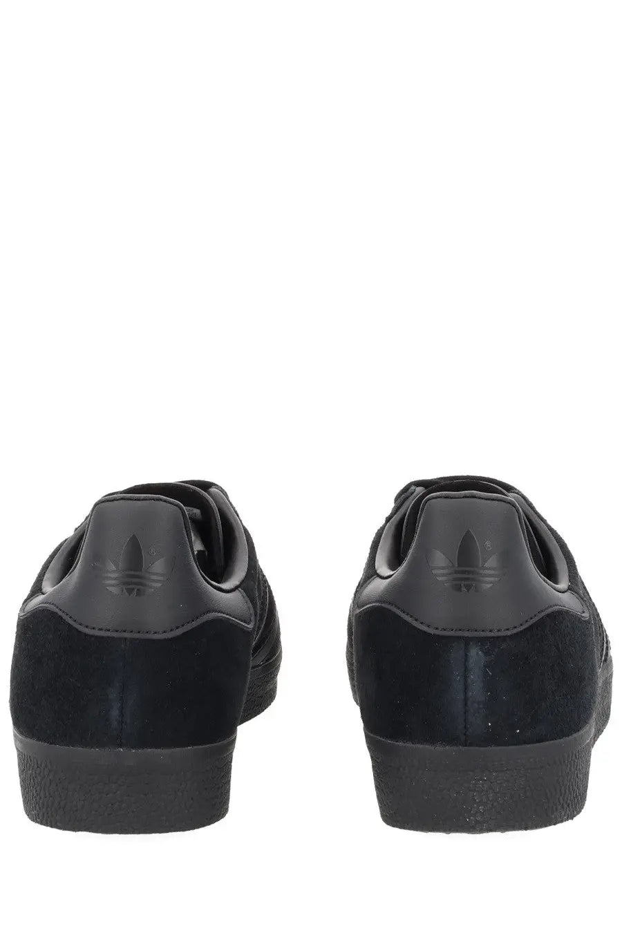 Black adidas unisex gazelle sneaker with suede and leather upper featuring iconic three-stripe design on the side