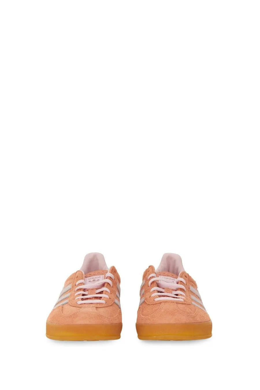 Peach-colored suede adidas gazelle unisex indoor sneaker with white stripes and translucent gum sole