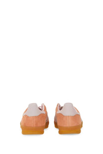Peach suede adidas unisex indoor gazelle sneaker with white heel tabs and translucent gum soles in blue product style