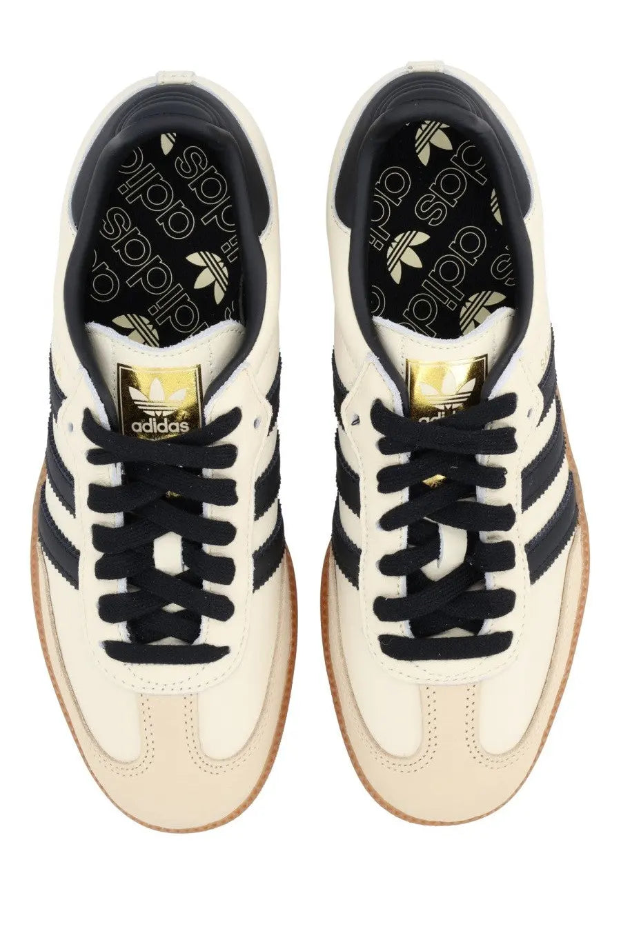 Beige adidas unisex samba og sneaker with cream-colored leather, black three stripes, black laces, and gold logo tongue