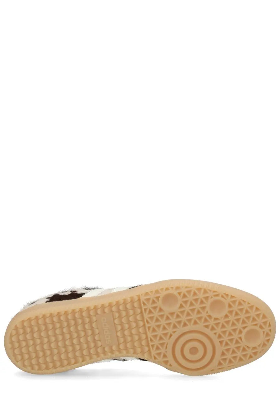 Adidas unisex Samba OG sneaker with white and black cowhide pattern and tan rubber sole with geometric tread design