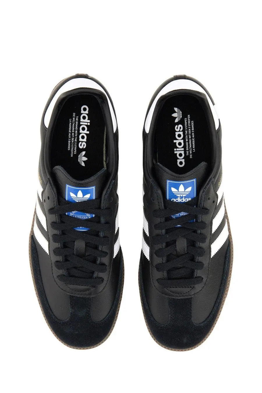 Black adidas unisex samba sneaker featuring white stripes and blue branding accents in a classic leather design