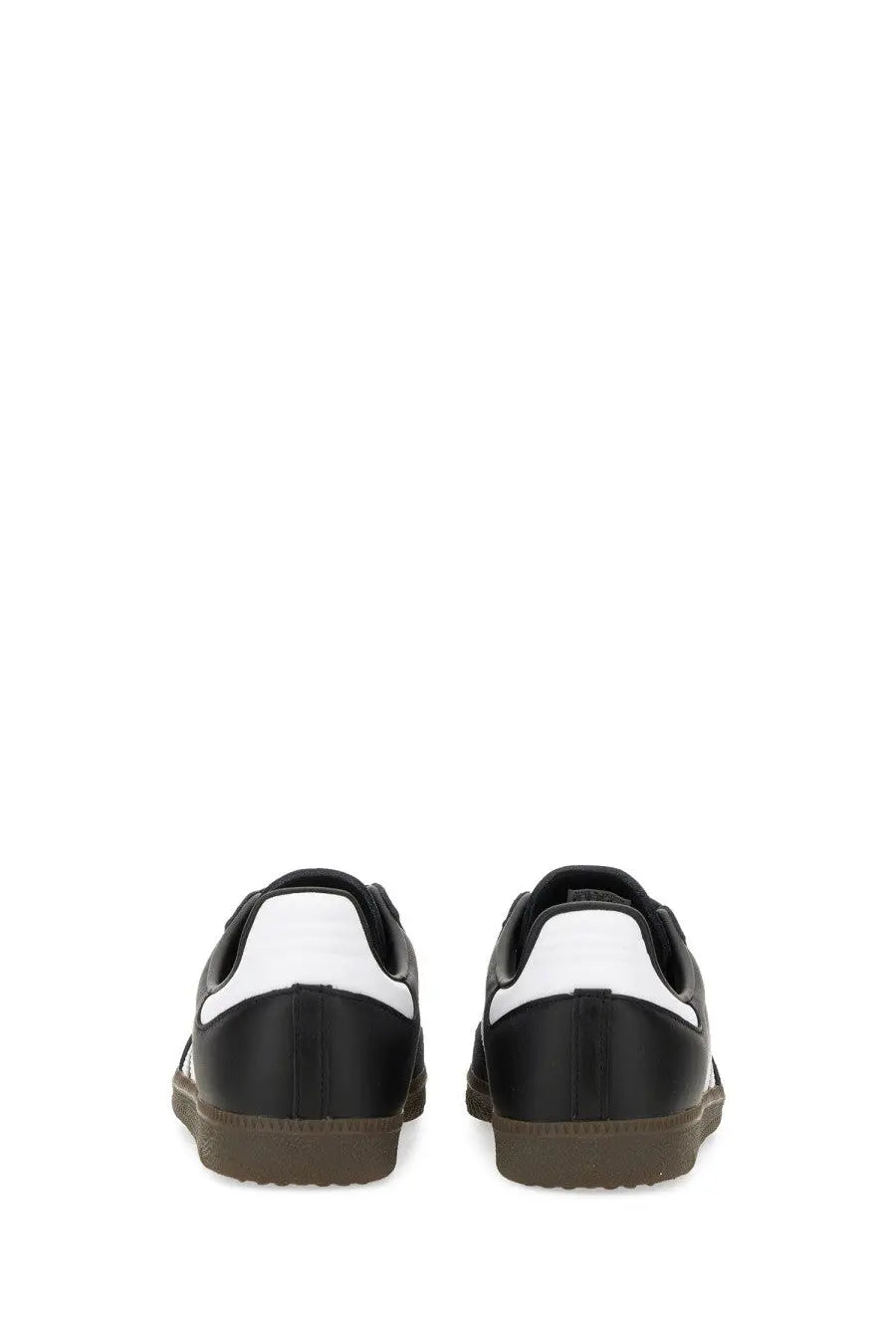 Adidas unisex samba sneaker black in black and white with gum rubber sole designed for casual wear