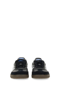 Adidas unisex samba sneaker black in black and white with gum rubber sole designed for casual and athletic wear