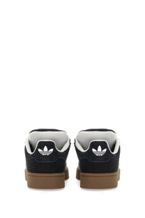 Black adidas unisex sneaker campus 00s with white logo and tan rubber soles showing the back side of the shoe
