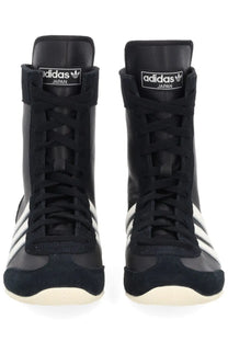 Black adidas unisex sneaker japan with white stripes and suede accents designed as lightweight boxing shoes