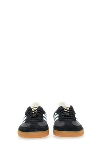 Adidas unisex sneaker samba black in black suede and leather with white stripes and gum rubber sole visible from front side