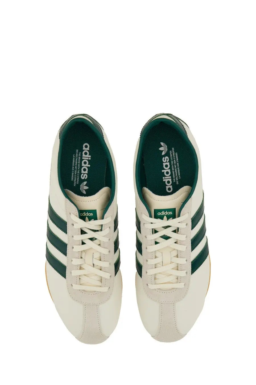 Cream-colored adidas unisex sneaker Tokyo white with dark green stripes and lining in classic retro design