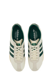Cream-colored adidas unisex sneaker Tokyo white with dark green stripes and lining in classic retro design