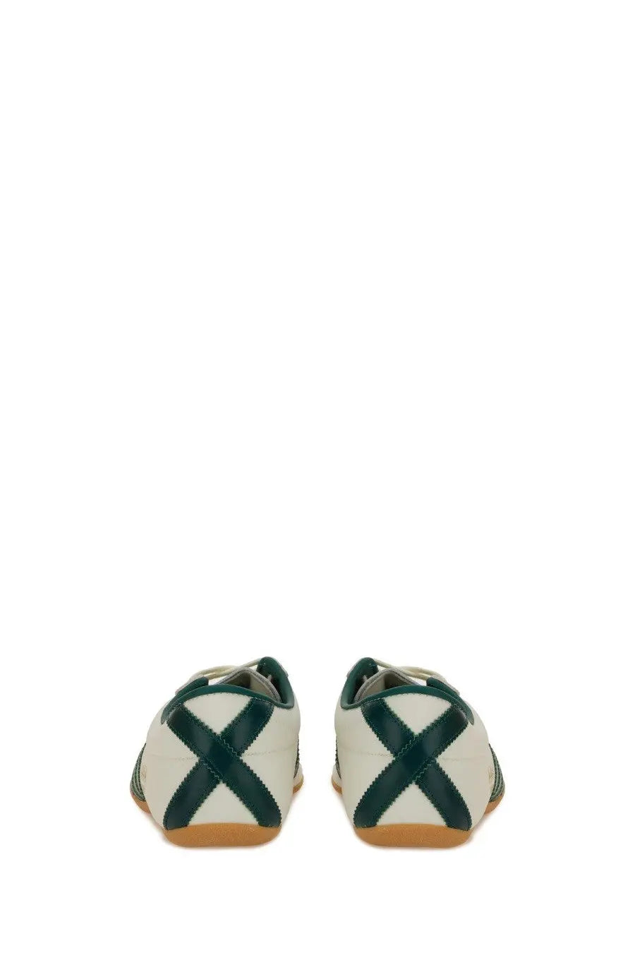 Adidas unisex sneaker tokyo white with white upper dark green cross straps and tan rubber soles visible from the front