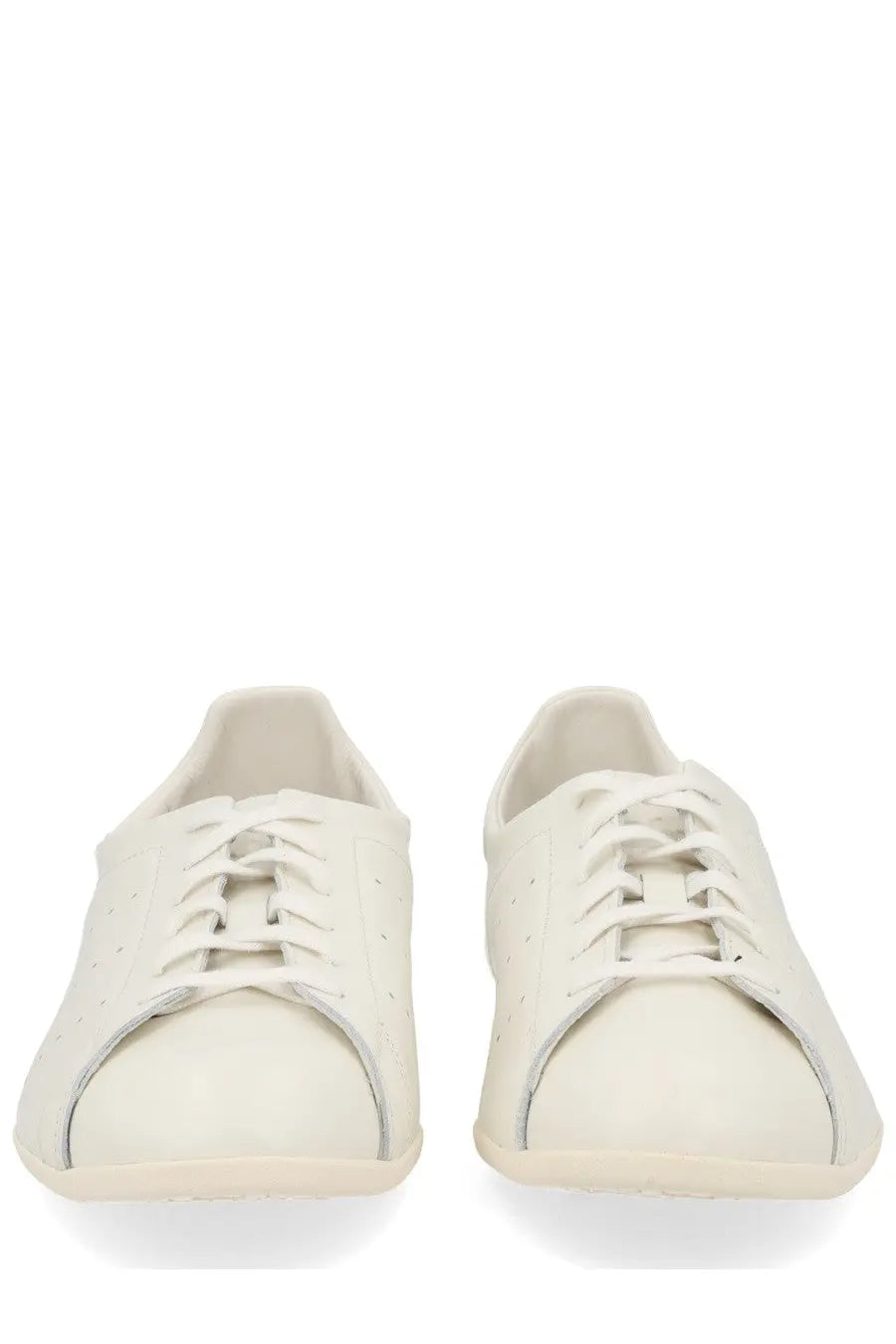 Adidas unisex stan smith lo pro sneaker white featuring cream-colored leather low-top design with subtle side perforations