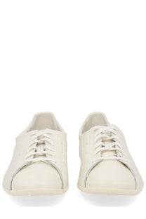 Adidas unisex stan smith lo pro sneaker white featuring cream-colored leather low-top design with subtle side perforations