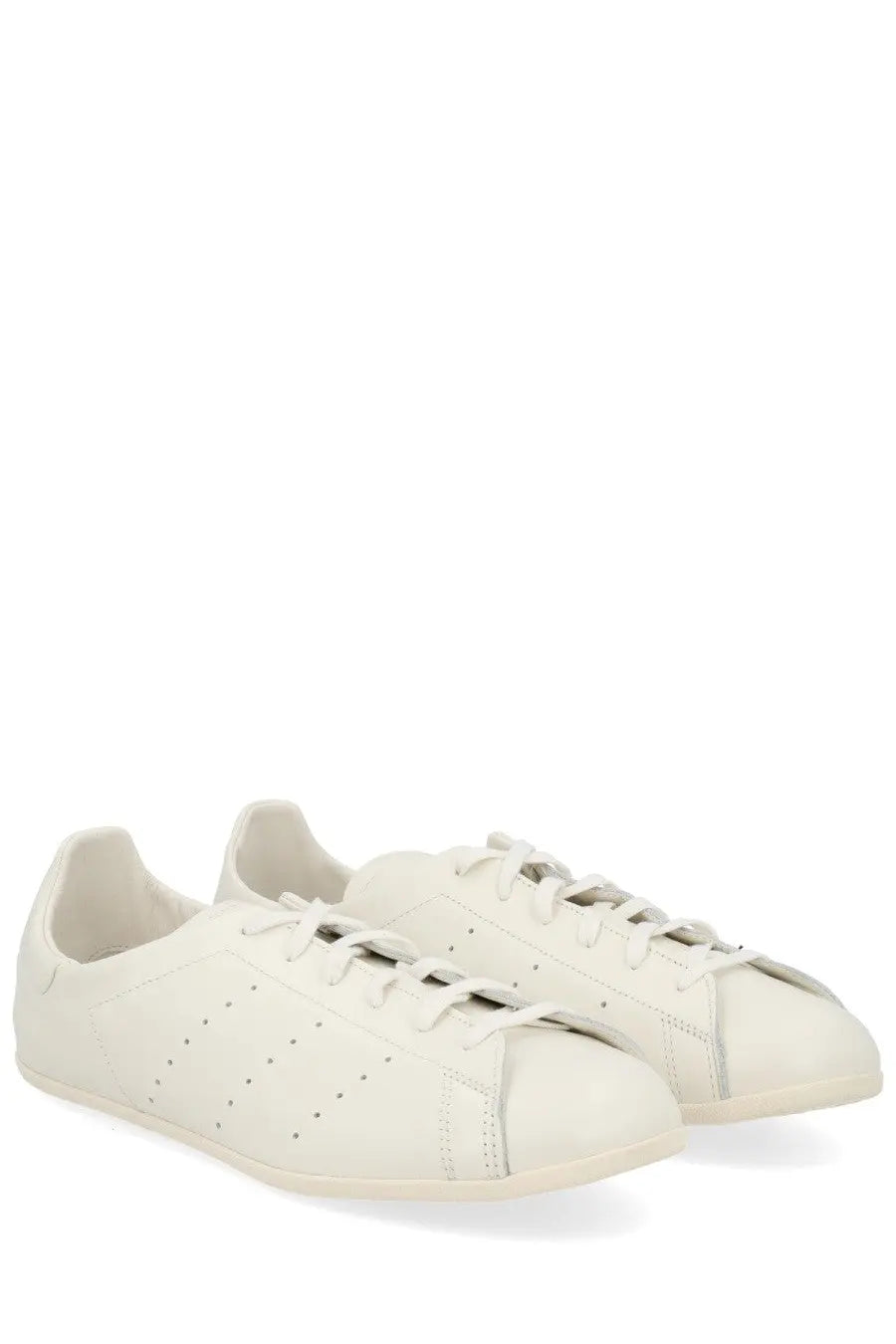 Cream-colored leather adidas unisex Stan Smith LO Pro sneaker with perforated detailing and classic low-top design