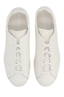 Adidas unisex stan smith lo pro sneaker in white leather with perforated detailing and classic lacing