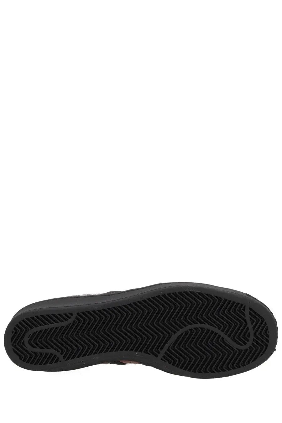 Black rubber sole with herringbone tread pattern on adidas unisex superstar vintage sneaker in red