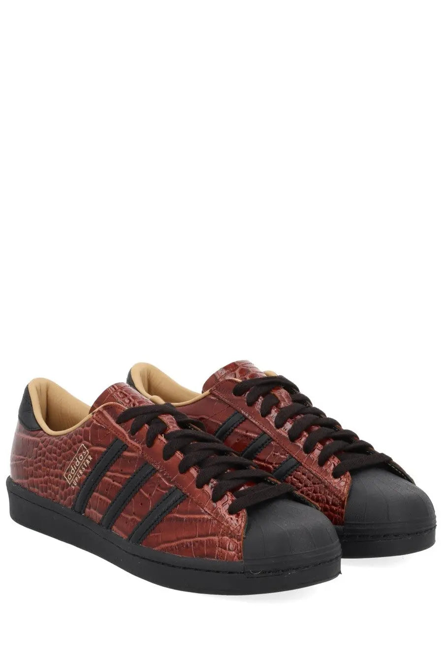 Adidas unisex superstar vintage sneaker in red with crocodile-embossed leather and black rubber toe caps and laces