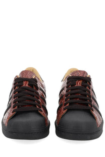 Adidas unisex superstar vintage sneaker in red crocodile-embossed leather with black laces and rubber toe cap