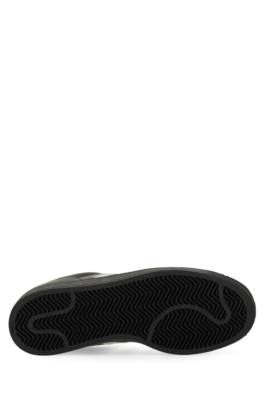 Black rubber sole with wavy tread pattern of adidas unisex superstar sneaker in black material