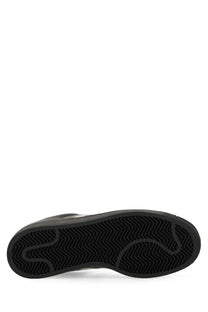Black rubber sole with wavy tread pattern of adidas unisex superstar sneaker in black material
