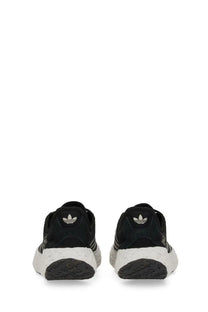 Black adidas unisex zponge sneaker with white rubber sole and three stripes on the side