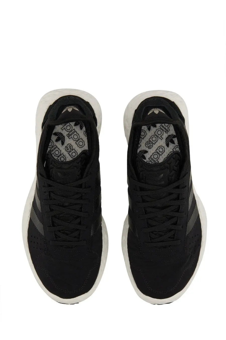 Adidas unisex zponge sneaker black with textured upper black body white soles and dark gray three stripes on sides