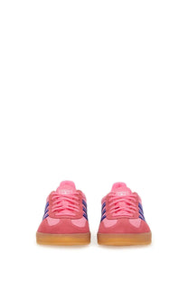 Adidas women’s gazelle indoor sneaker in pink with purple stripes and a gum-colored sole