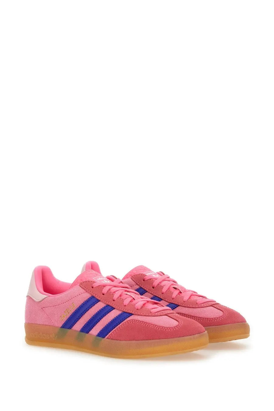 Adidas women’s gazelle indoor sneaker in pink suede with bold blue stripes and translucent gum sole