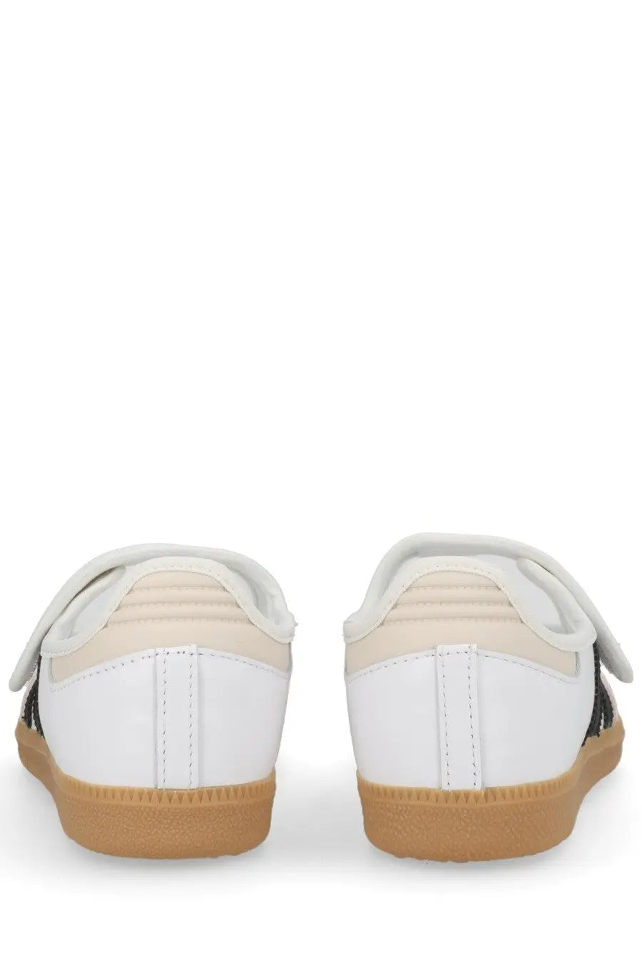 Adidas women’s samba jane sneaker in white with black accents and tan rubber sole designed for casual wear