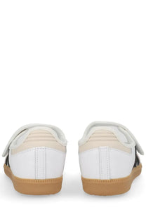 Adidas women’s samba jane sneaker in white with black accents and tan rubber sole designed for casual wear