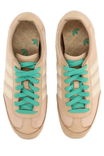 Adidas women’s sneaker japan warsan beige in beige suede with teal laces and classic three-stripe design