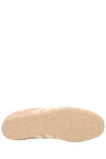 Beige adidas women’s sneaker japan warsan with three-tone stripes and a textured rubber sole