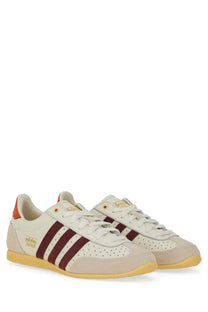 Adidas women’s sneaker japan white cream colored with maroon stripes and yellow sole for casual wear