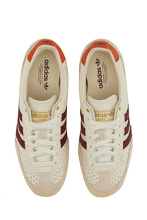Adidas women’s sneaker japan white cream-colored with maroon stripes orange heel accents perforated leather upper