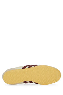 Adidas women’s sneaker Japan white in white and maroon with three stripes on the side for casual wear