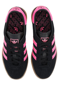 Adidas women’s sneaker muenchen black black suede with vibrant pink stripes heel branding and interior logo detailing